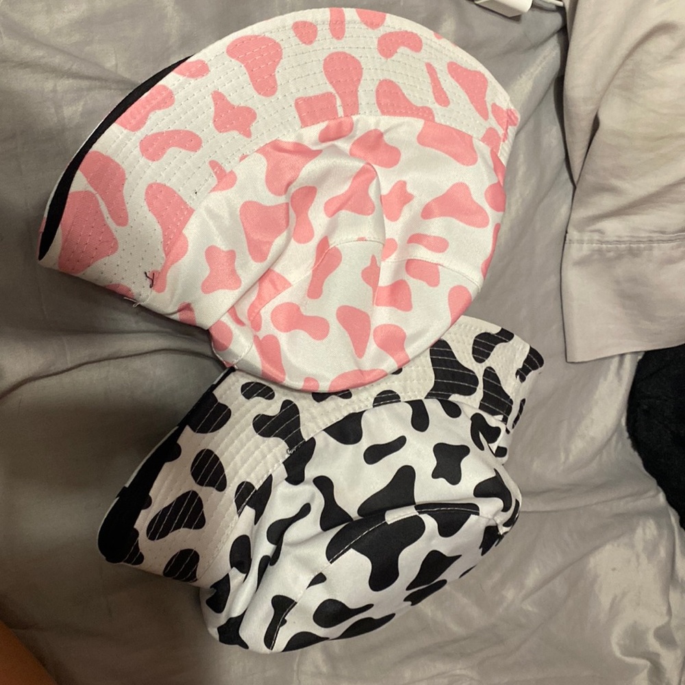 2 cow print bucket hats